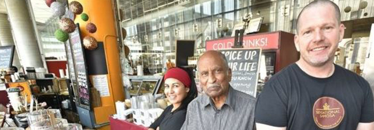 Owners stand proudly on front of their stall