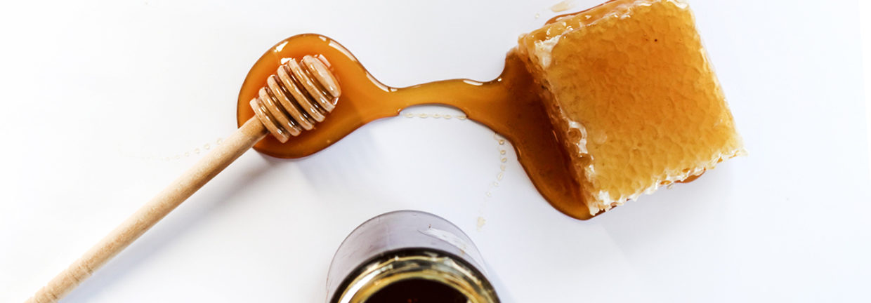 honey dripping from container
