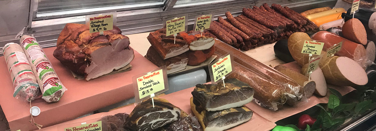 Leslie's European Deli counter display of meat & deli products