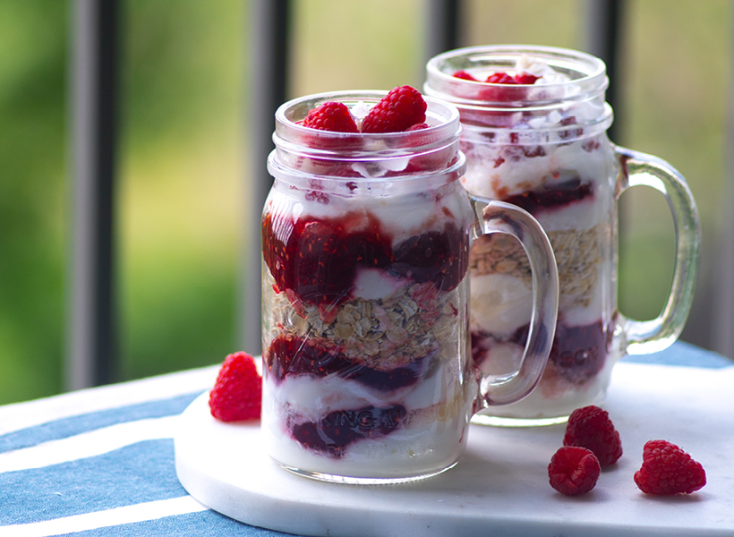Raspberries, Oats, Milk & Banana all in a cup waiting to be blending into a smoothie